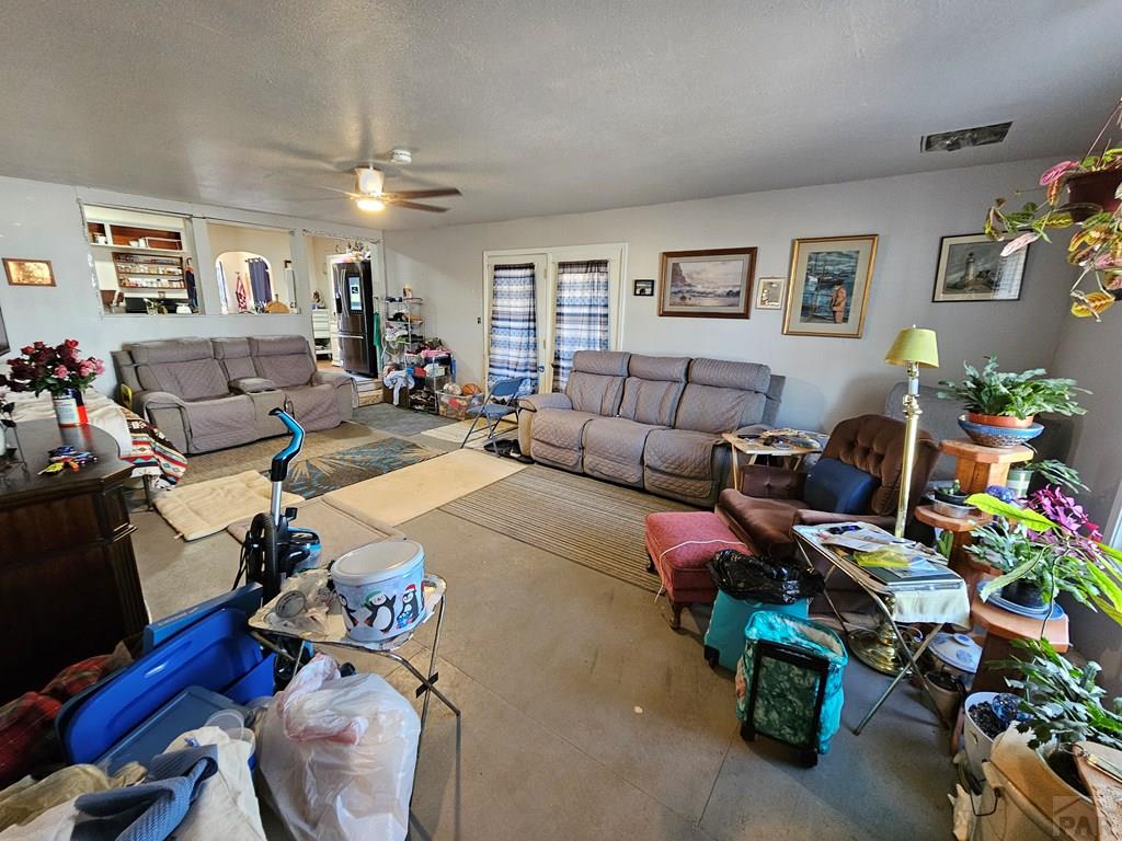 233 East 5th Avenue Springfield, CO 81073 - Photo 11 of 30 a living room with furniture and wooden floor