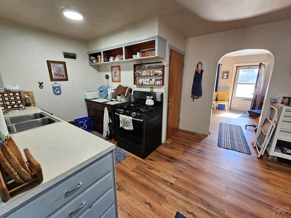 233 East 5th Avenue Springfield, CO 81073 - Photo 13 of 30 a living room with hard wood flooring and furniture