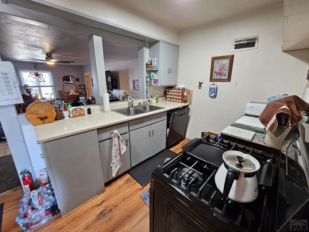 233 East 5th Avenue Springfield, CO 81073 - Photo 14 of 30 a kitchen with a sink stove and cabinets