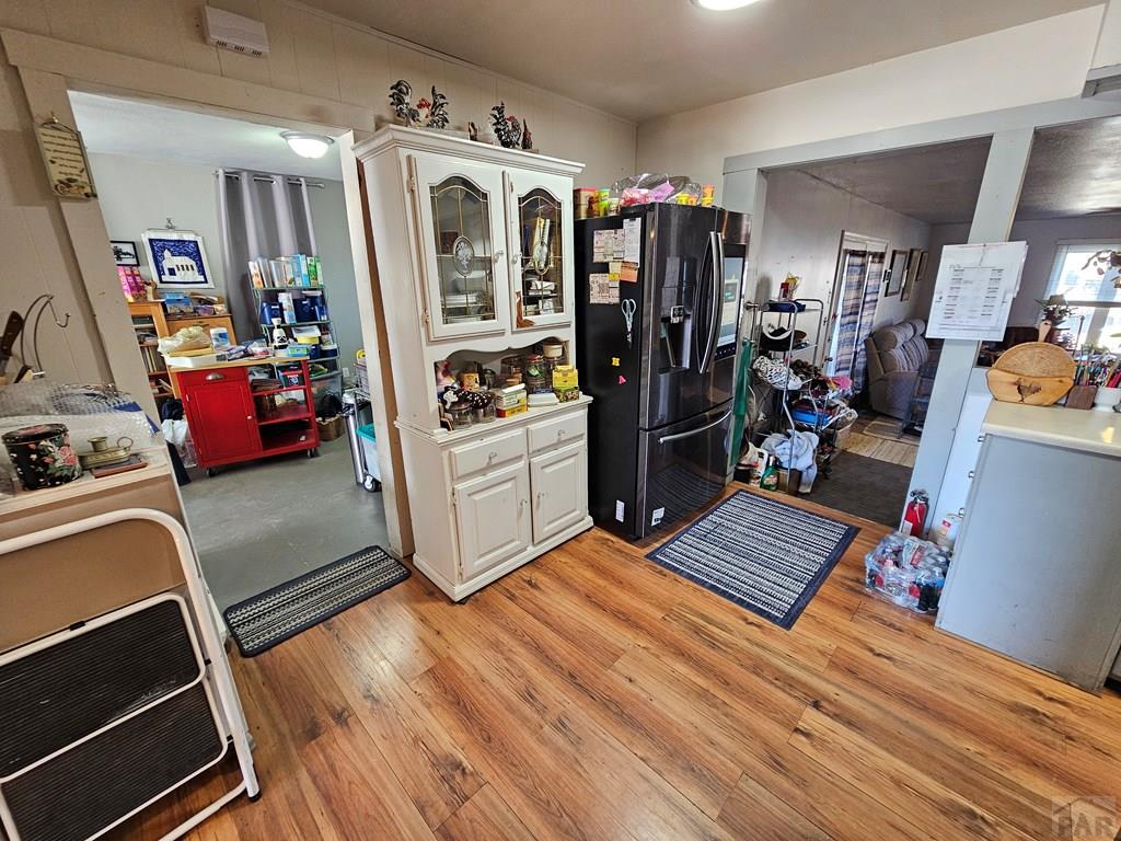 233 East 5th Avenue Springfield, CO 81073 - Photo 15 of 30 a view of walk in closet with clothes and shoes