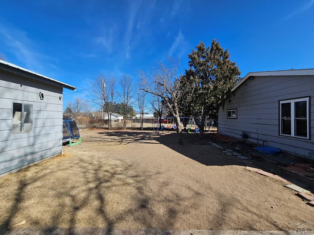 233 East 5th Avenue Springfield, CO 81073 - Photo 27 of 30 a view of road with large trees
