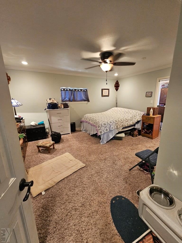 233 East 5th Avenue Springfield, CO 81073 - Photo 10 of 30 a bedroom with a bed and a chandelier