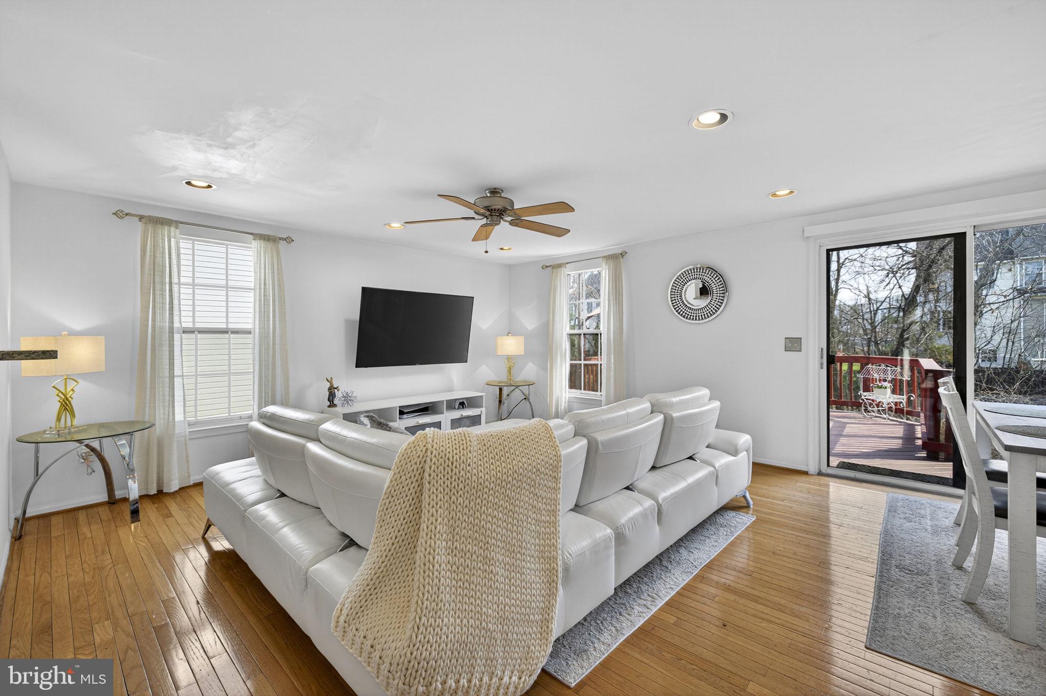 45430 Gable Square Sterling, VA 20164 - Photo 12 of 52 a living room with furniture and a flat screen tv
