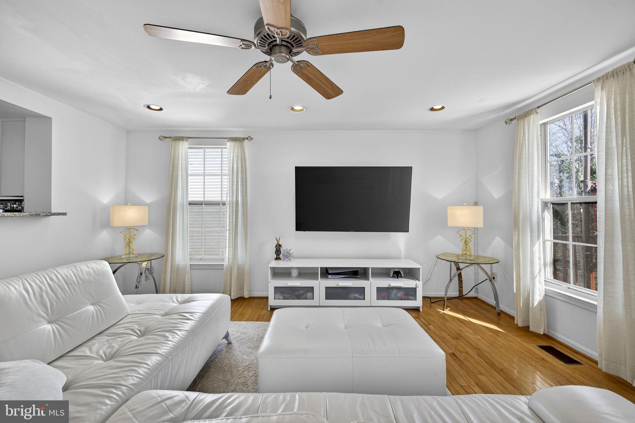 45430 Gable Square Sterling, VA 20164 - Photo 13 of 52 a living room with furniture and a flat screen tv