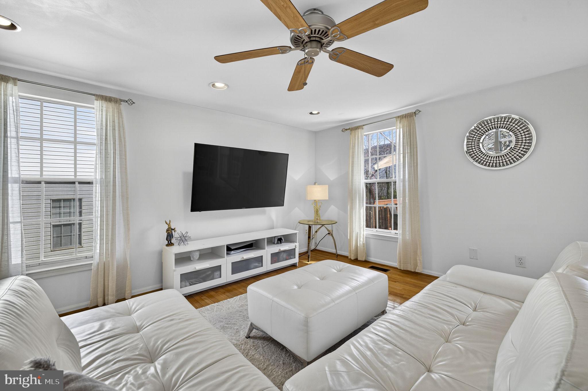 45430 Gable Square Sterling, VA 20164 - Photo 15 of 52 a bedroom with a bed and a flat screen tv