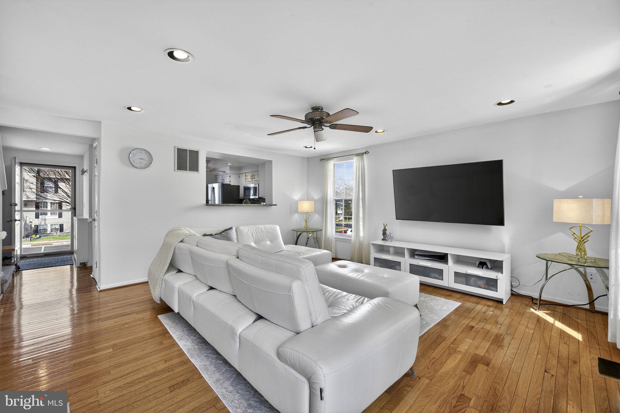 45430 Gable Square Sterling, VA 20164 - Photo 18 of 52 a living room with furniture and a flat screen tv