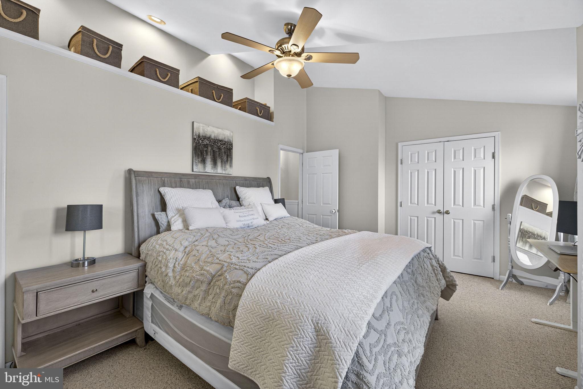 45430 Gable Square Sterling, VA 20164 - Photo 24 of 52 a bedroom with a bed and a chandelier