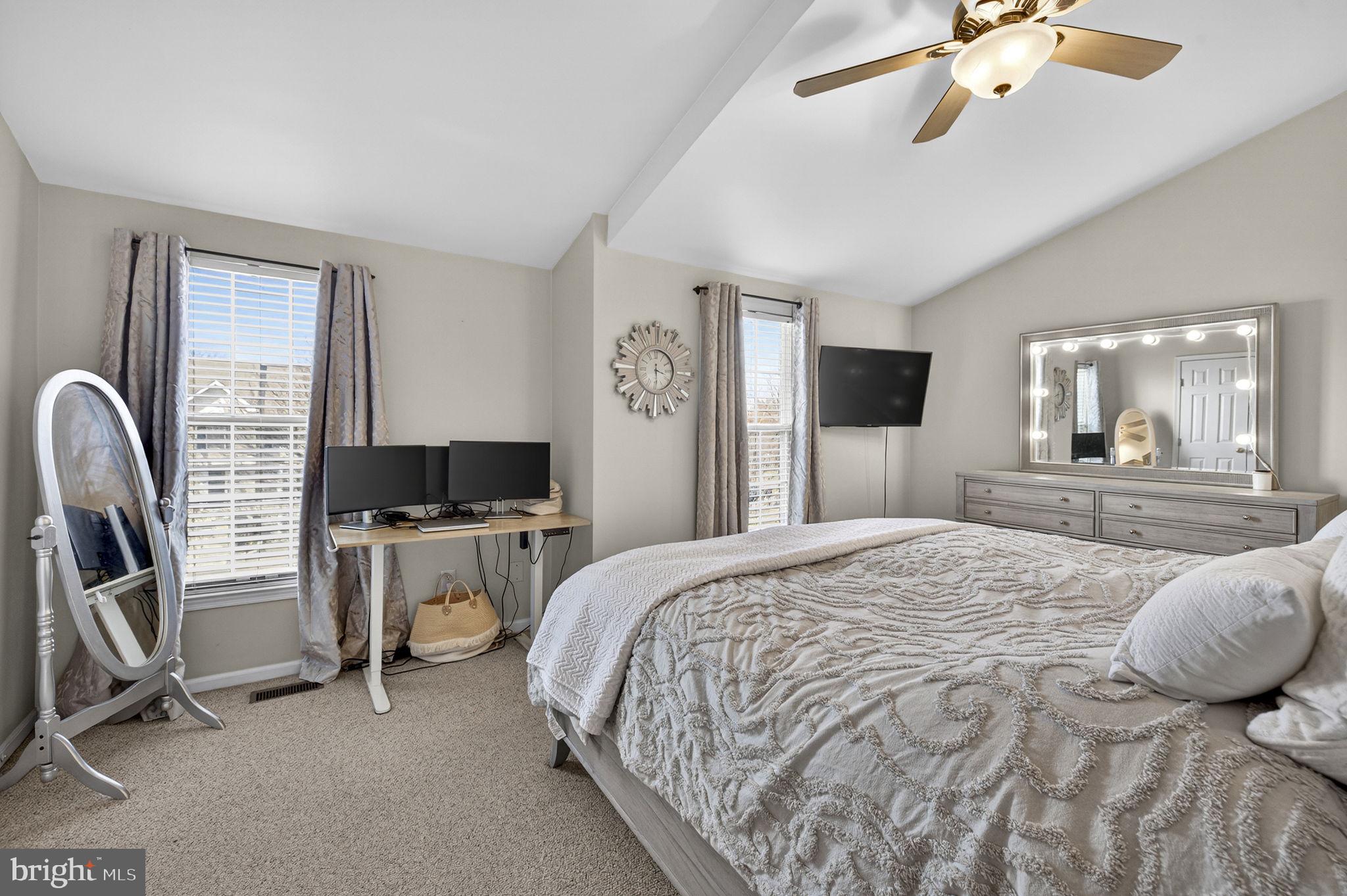 45430 Gable Square Sterling, VA 20164 - Photo 25 of 52 a spacious bedroom with a bed a desk and chair