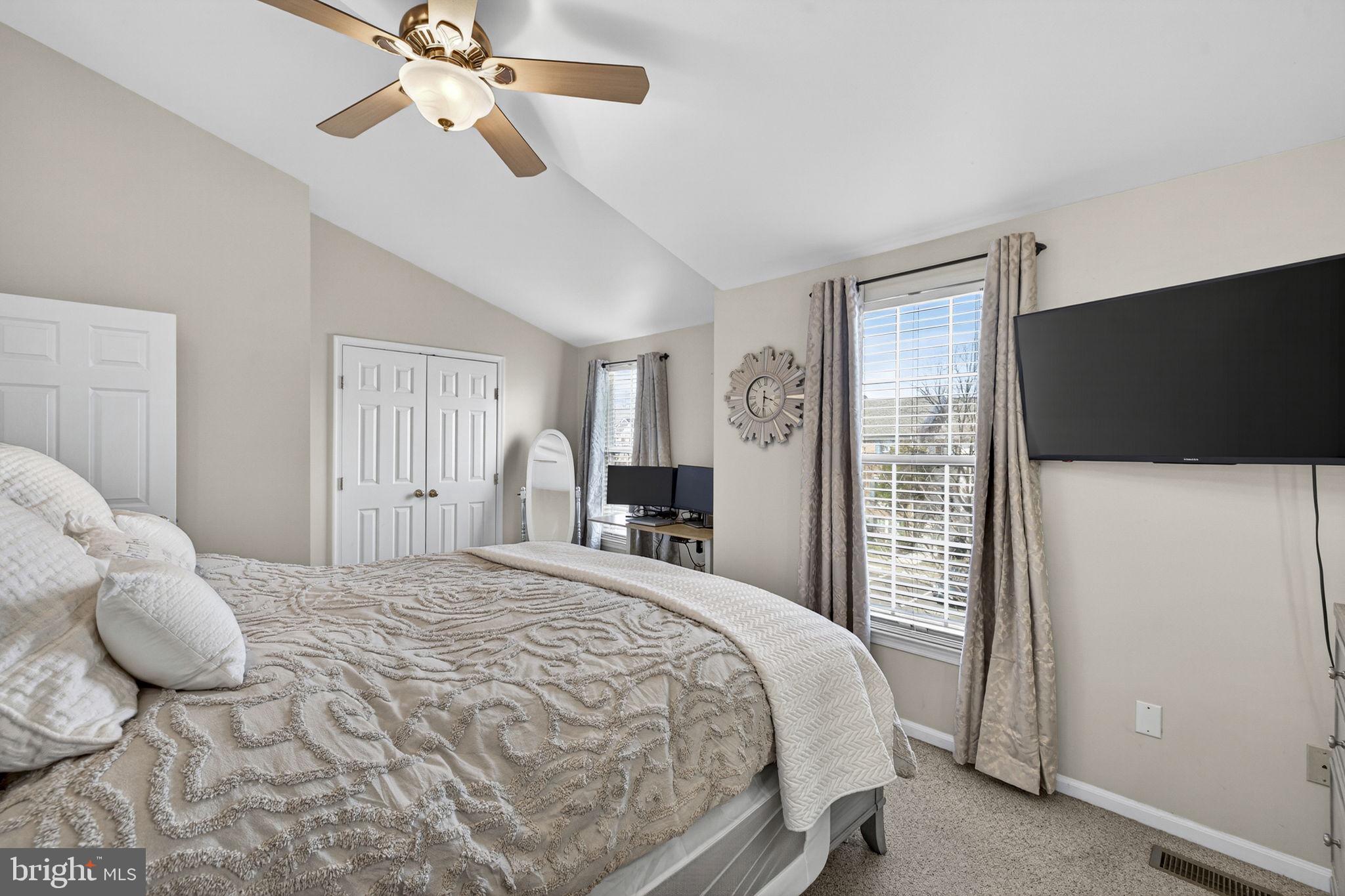 45430 Gable Square Sterling, VA 20164 - Photo 26 of 52 a bedroom with a bed and a flat screen tv