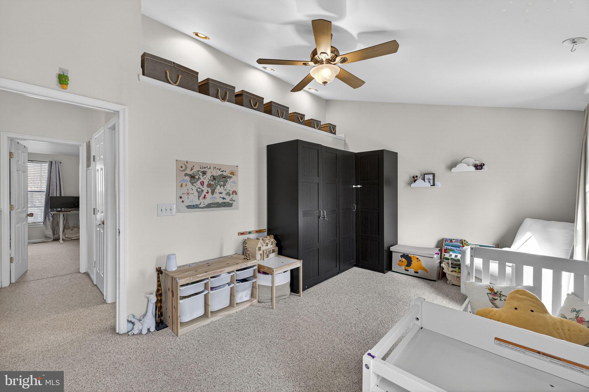 45430 Gable Square Sterling, VA 20164 - Photo 31 of 52 a bedroom with furniture and a chandelier