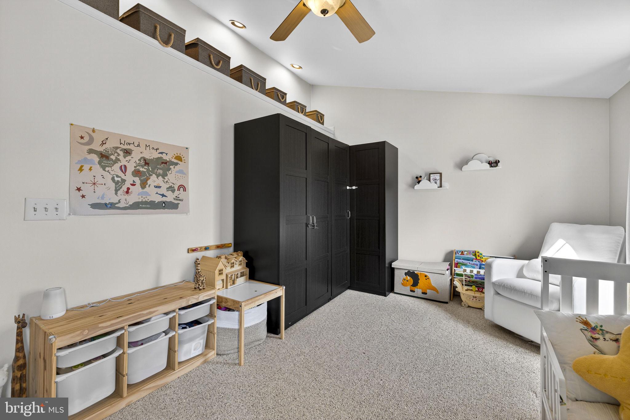 45430 Gable Square Sterling, VA 20164 - Photo 32 of 52 a bedroom with furniture and a chandelier