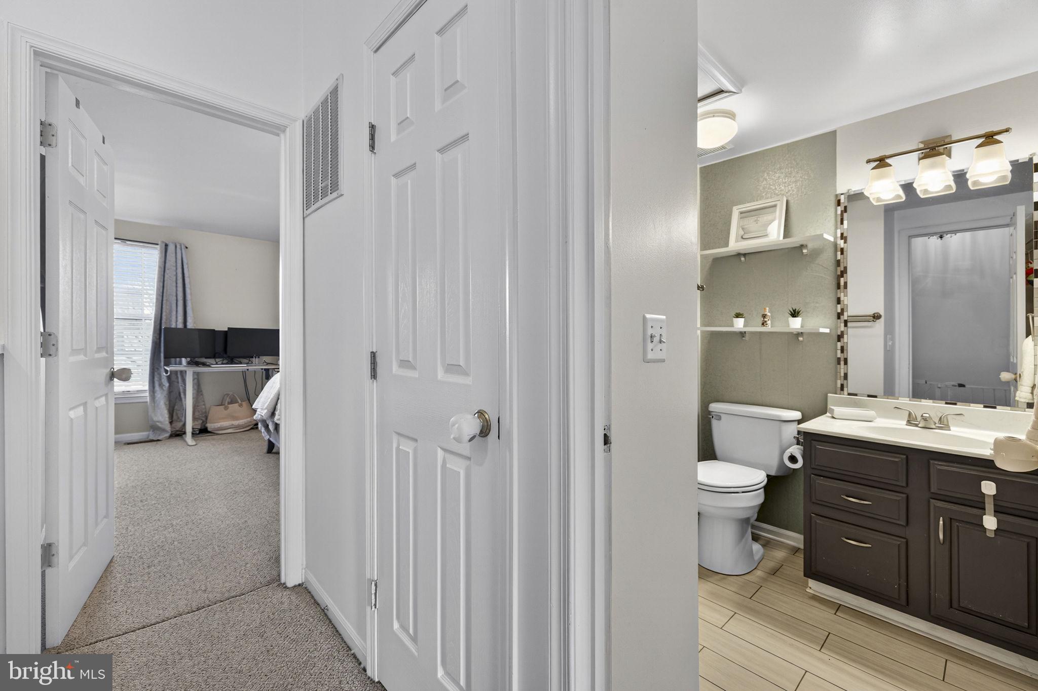 45430 Gable Square Sterling, VA 20164 - Photo 34 of 52 a bathroom with a double vanity sink toilet and shower