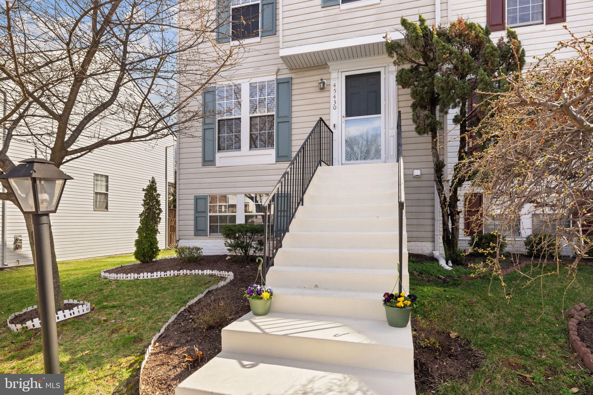 45430 Gable Square Sterling, VA 20164 - Photo 4 of 52 a view of a house with a yard