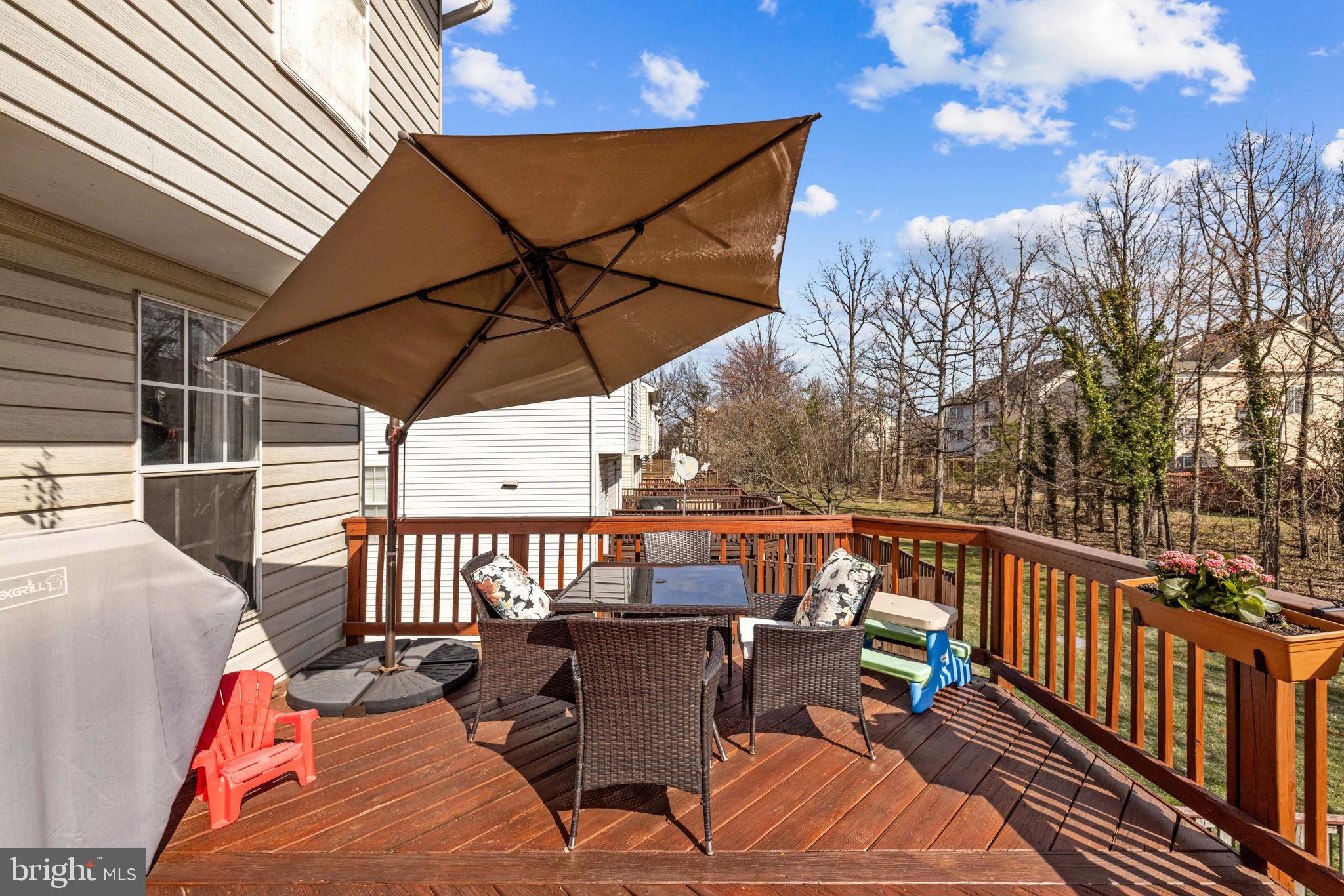 45430 Gable Square Sterling, VA 20164 - Photo 42 of 52 a view of a balcony with furniture and wooden floor