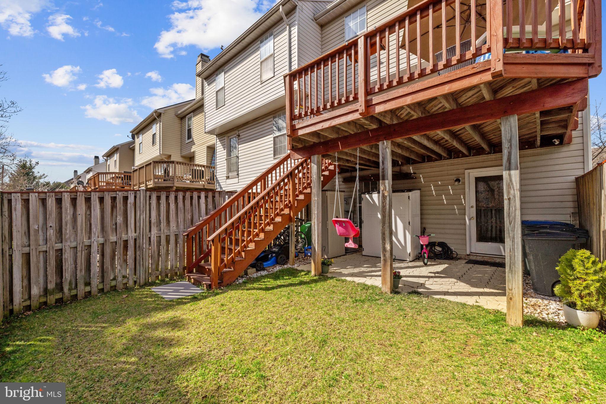 45430 Gable Square Sterling, VA 20164 - Photo 43 of 52 a view of a house with wooden deck and furniture