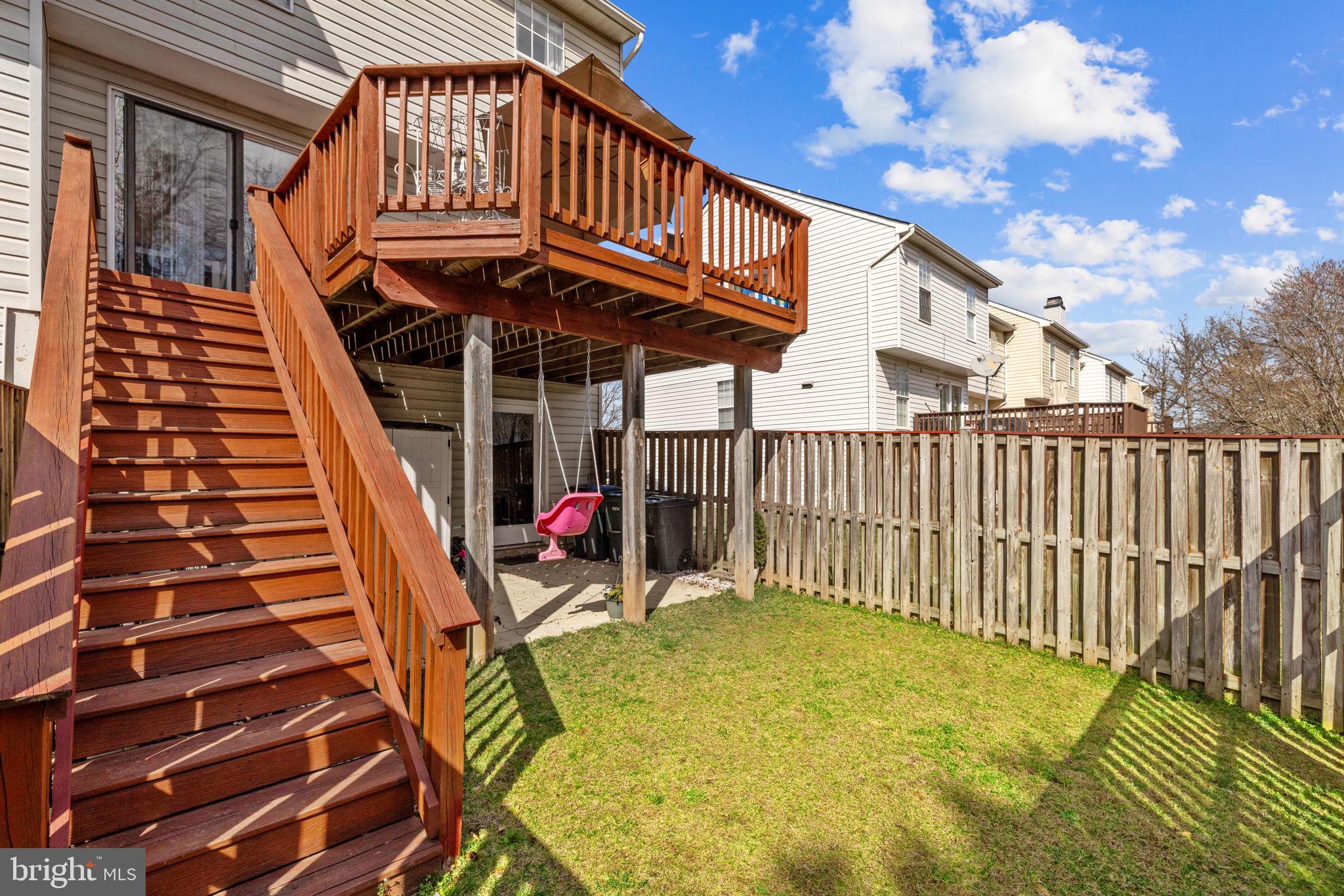 45430 Gable Square Sterling, VA 20164 - Photo 45 of 52 a view of a patio with table and chairs with wooden floor and fence