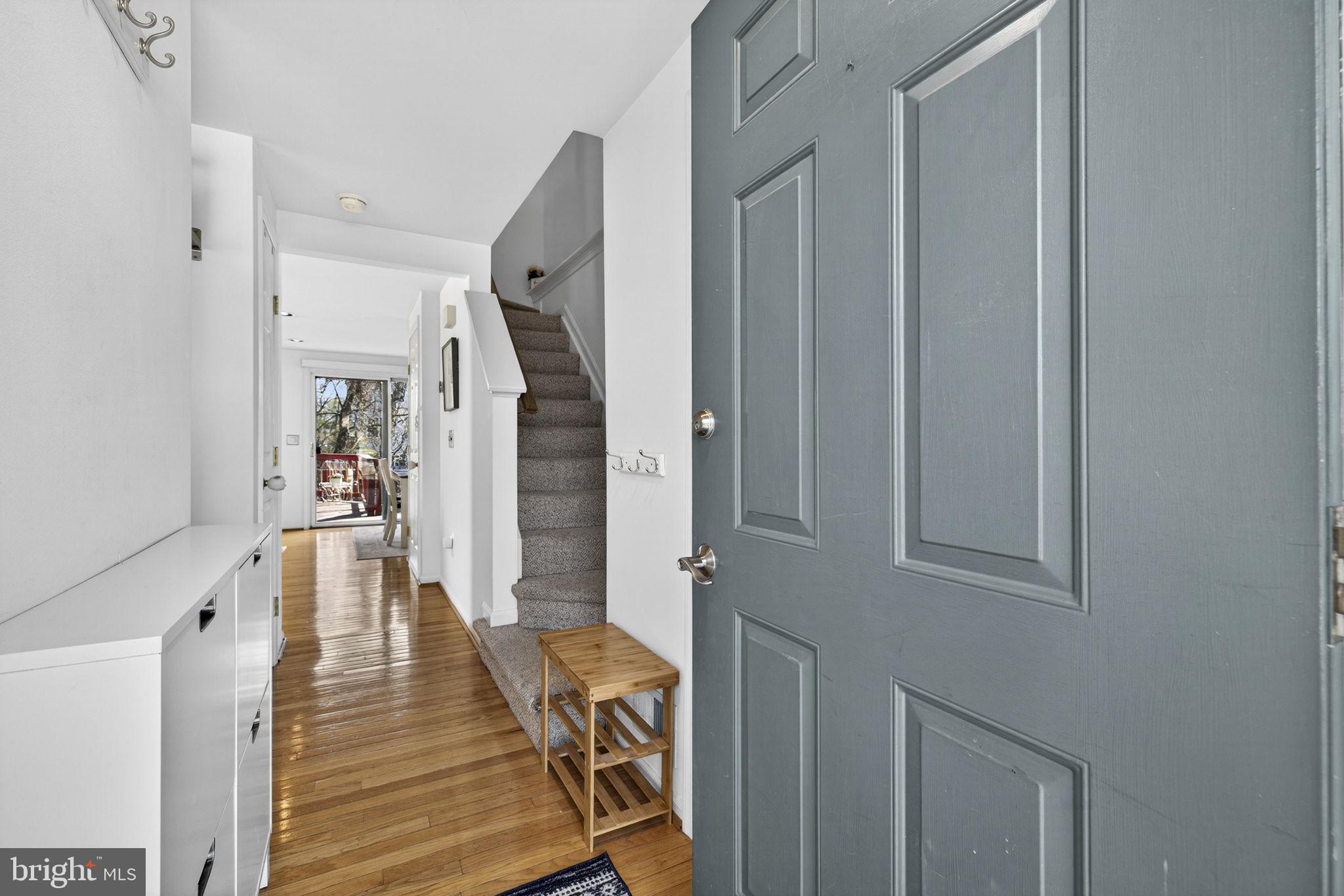 45430 Gable Square Sterling, VA 20164 - Photo 5 of 52 a view of a hallway with wooden floor and staircase