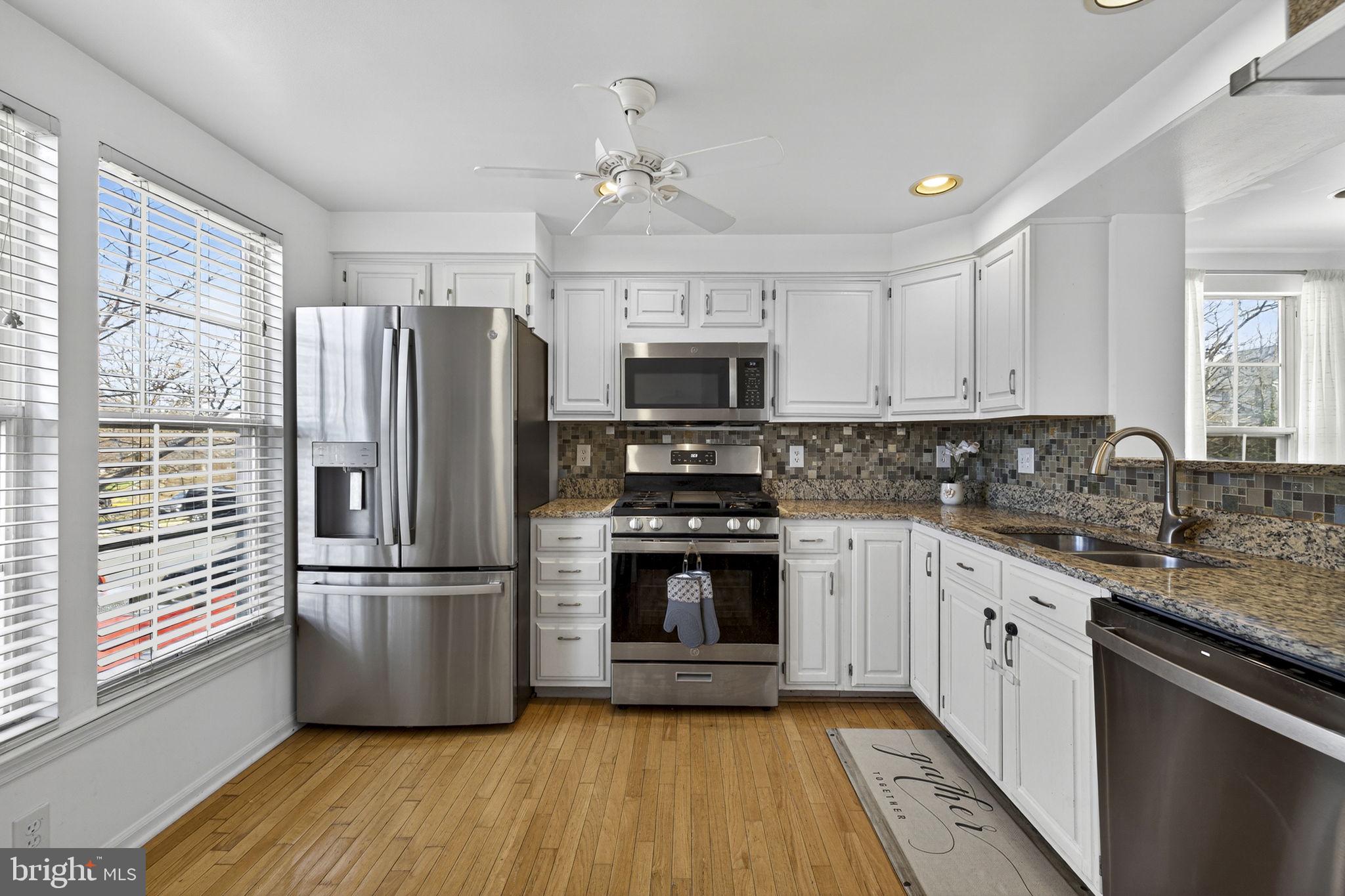 45430 Gable Square Sterling, VA 20164 - Photo 7 of 52 a kitchen with stainless steel appliances a refrigerator sink and microwave