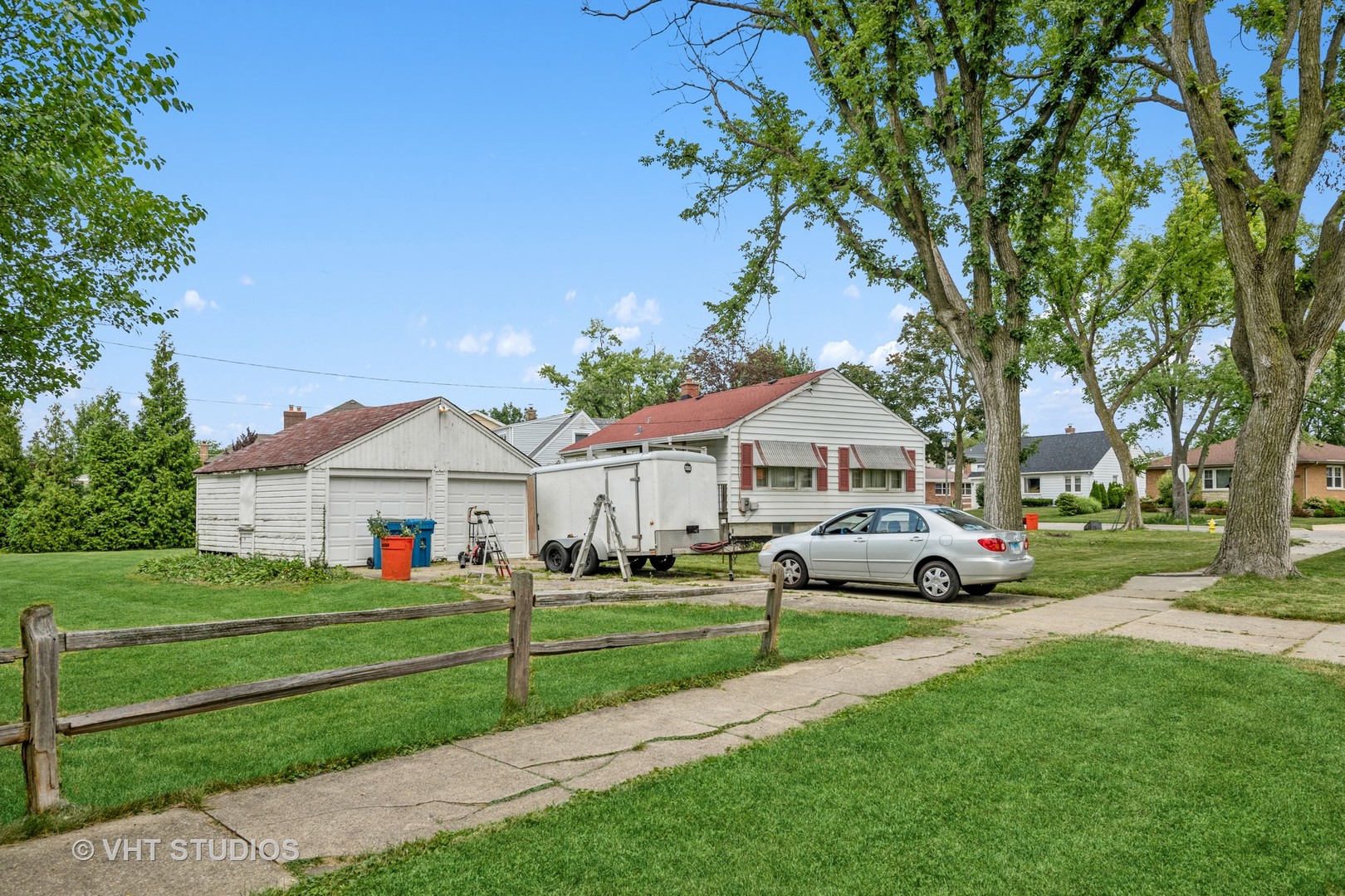 862 South Poplar Avenue Elmhurst, IL 60126 - Photo 11 of 11 a front view of a house with a garden and trees