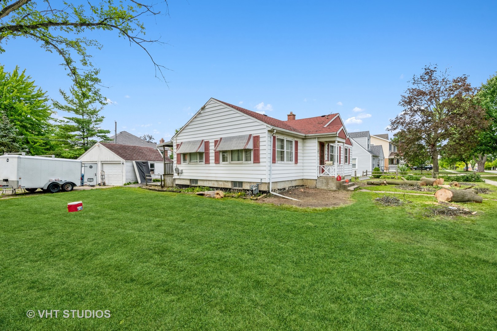 862 South Poplar Avenue Elmhurst, IL 60126 - Photo 10 of 11 a front view of a house with a yard table and chairs