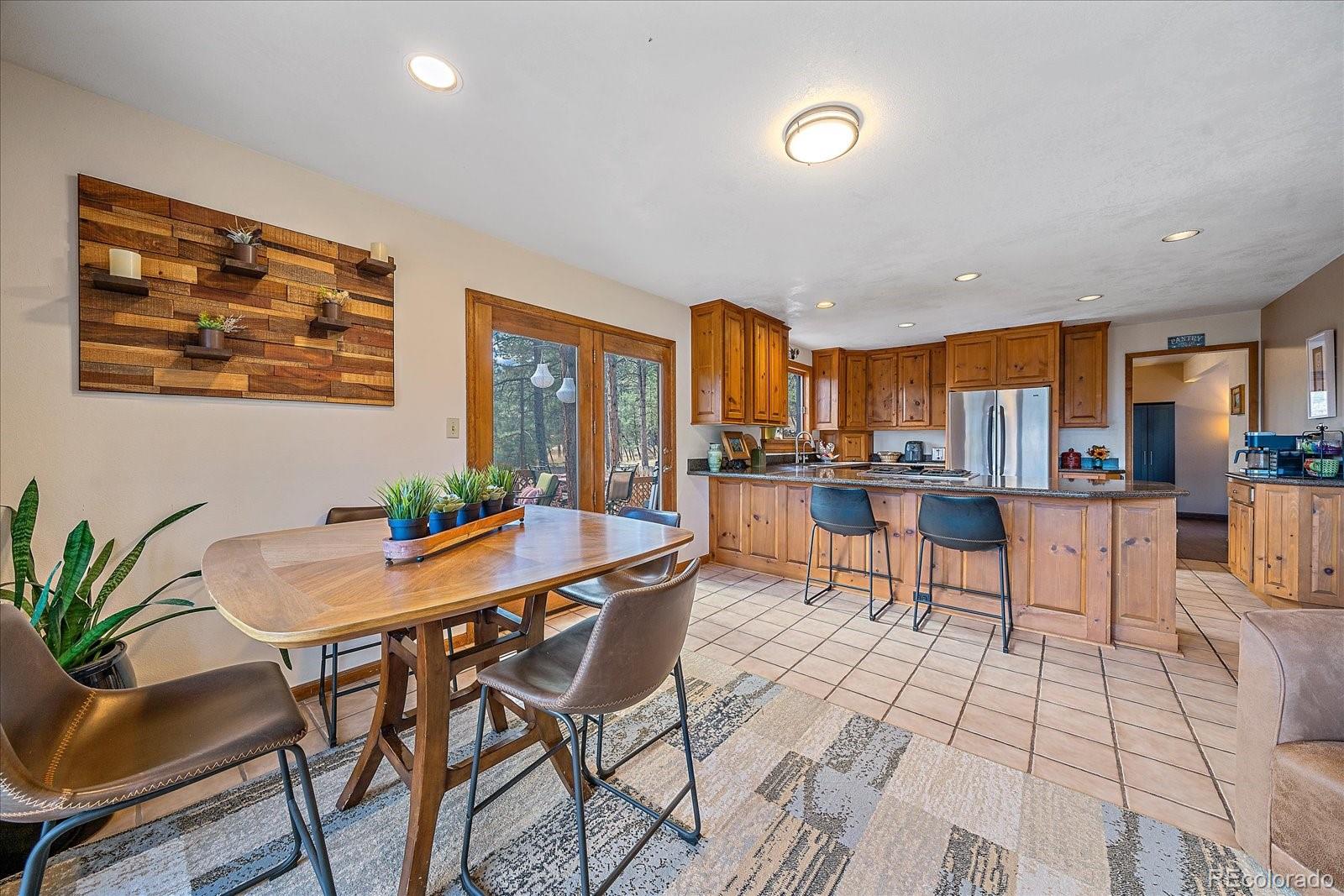 4059 Histead Way Evergreen, CO 80439 - Photo 16 of 37 a view of a dining room with furniture