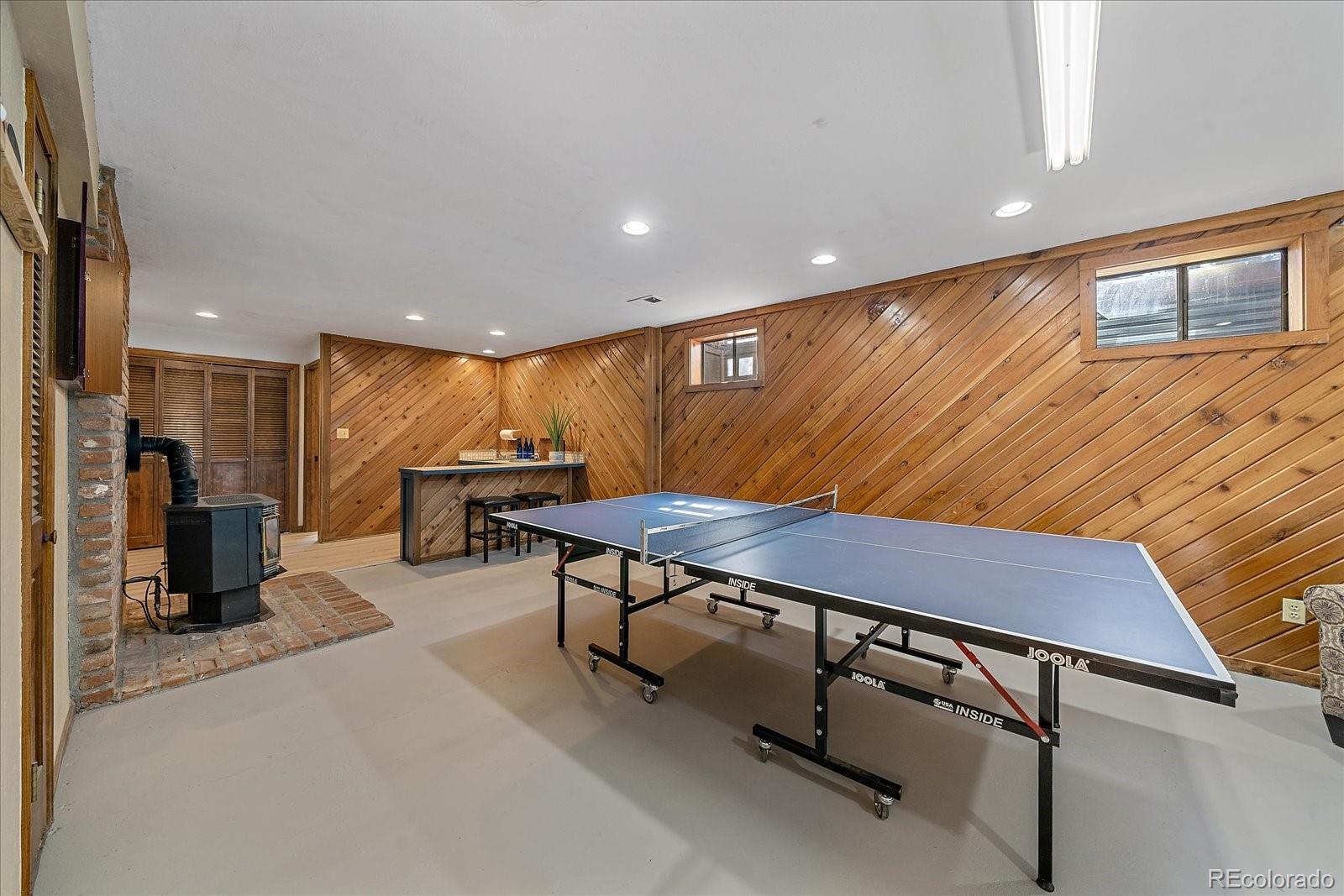 4059 Histead Way Evergreen, CO 80439 - Photo 32 of 37 a room with table tennis air hockey table and arcade game machine