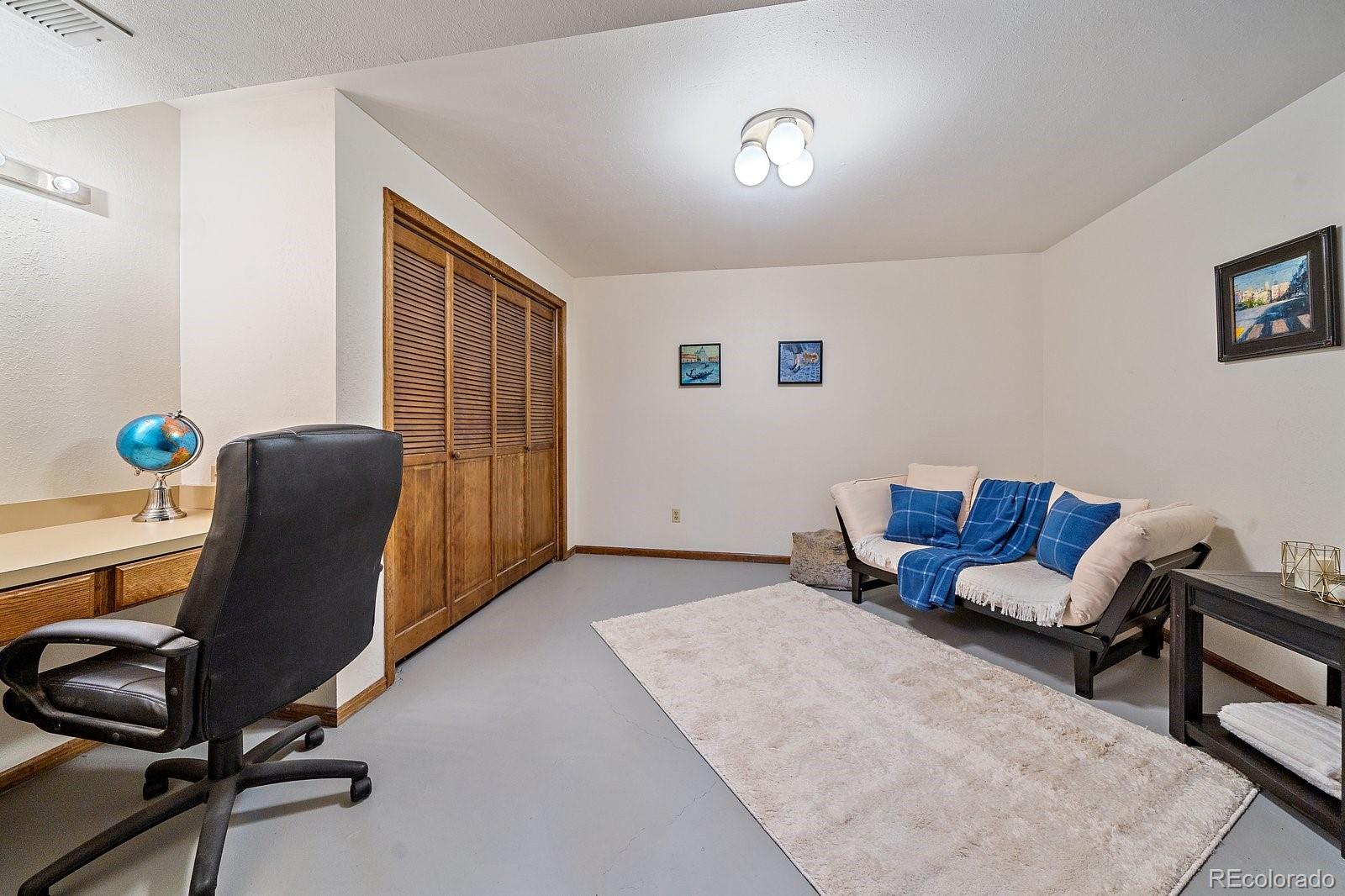 4059 Histead Way Evergreen, CO 80439 - Photo 33 of 37 a living room with furniture rug and a window