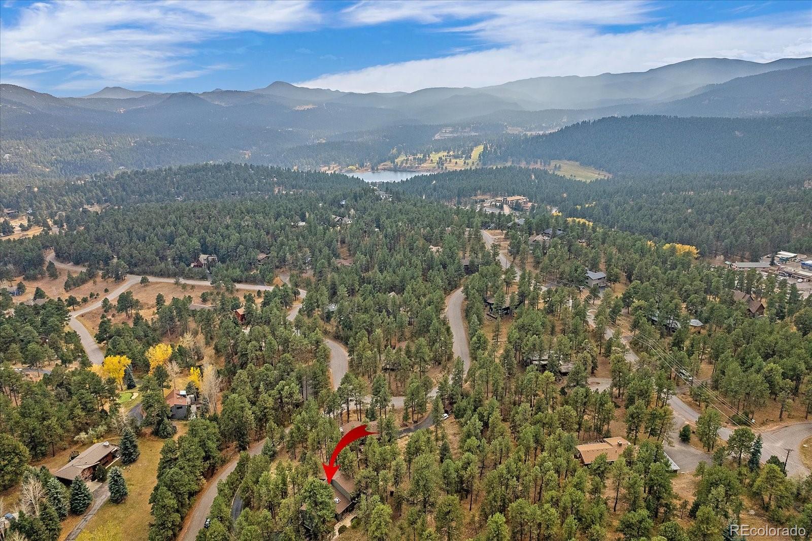4059 Histead Way Evergreen, CO 80439 - Photo 37 of 37 a view of a town with mountains in the background