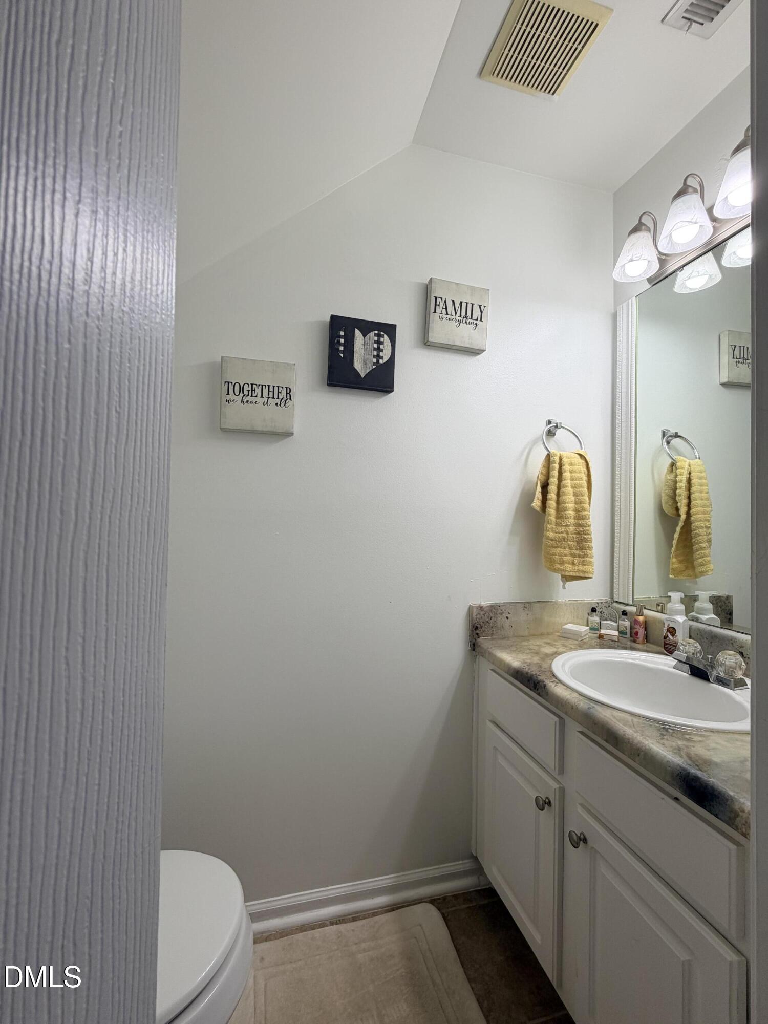 5345 Glen Canyon Road Raleigh, NC 27616 - Photo 11 of 21 a bathroom with a granite countertop sink vanity mirror and toilet