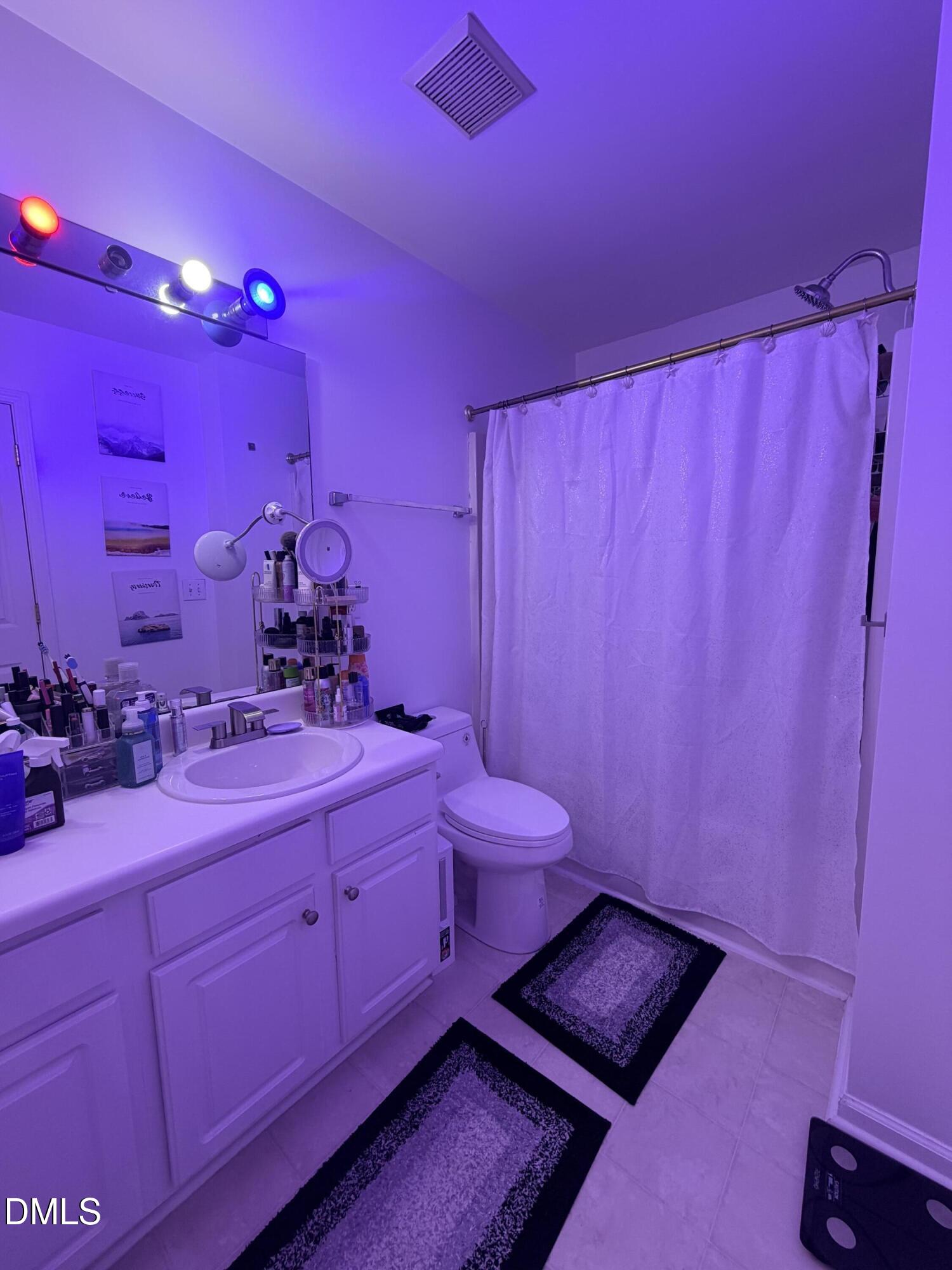 5345 Glen Canyon Road Raleigh, NC 27616 - Photo 17 of 21 a bathroom with a sink and a mirror