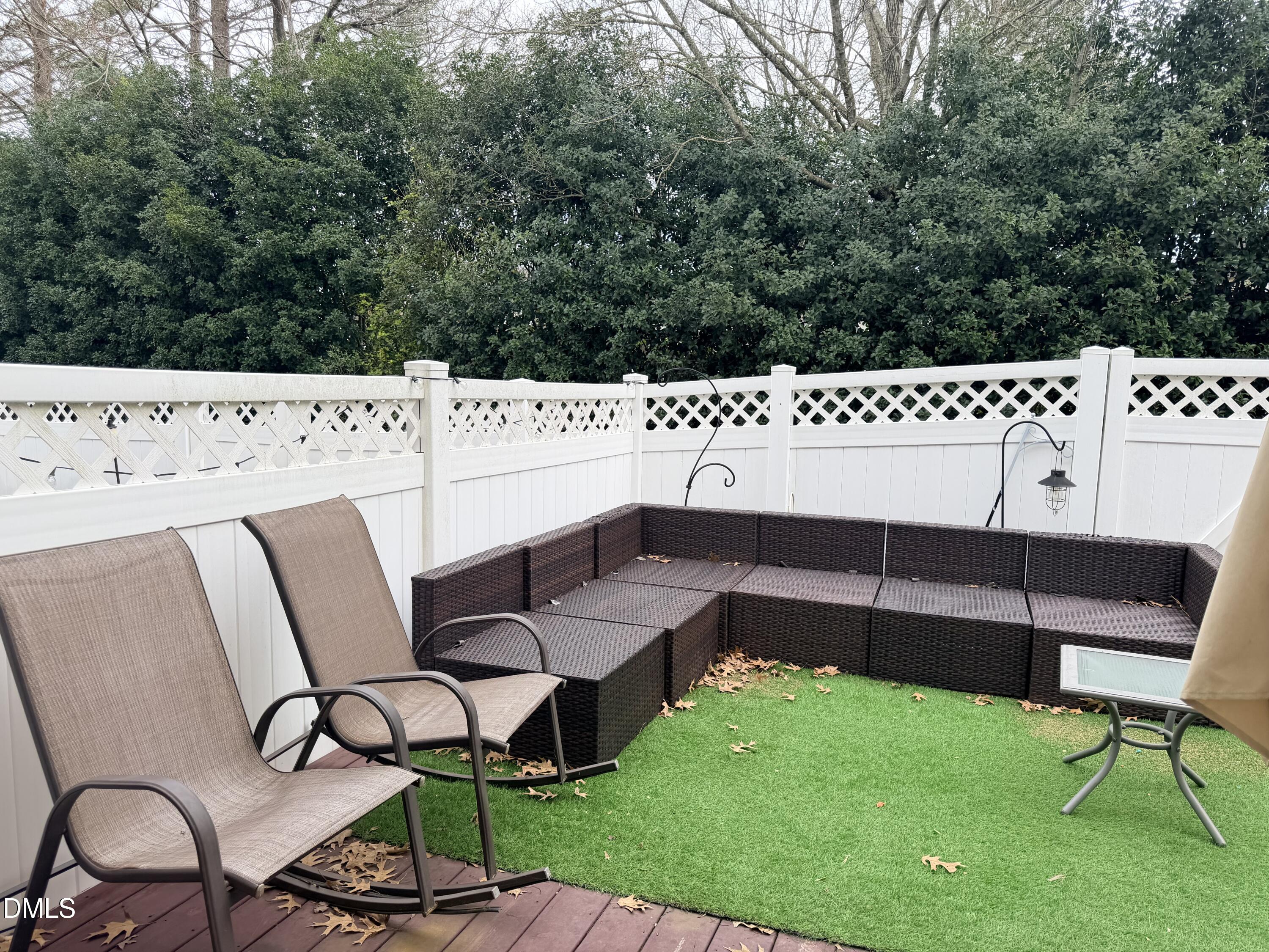 5345 Glen Canyon Road Raleigh, NC 27616 - Photo 20 of 21 a backyard of a house with table and chairs