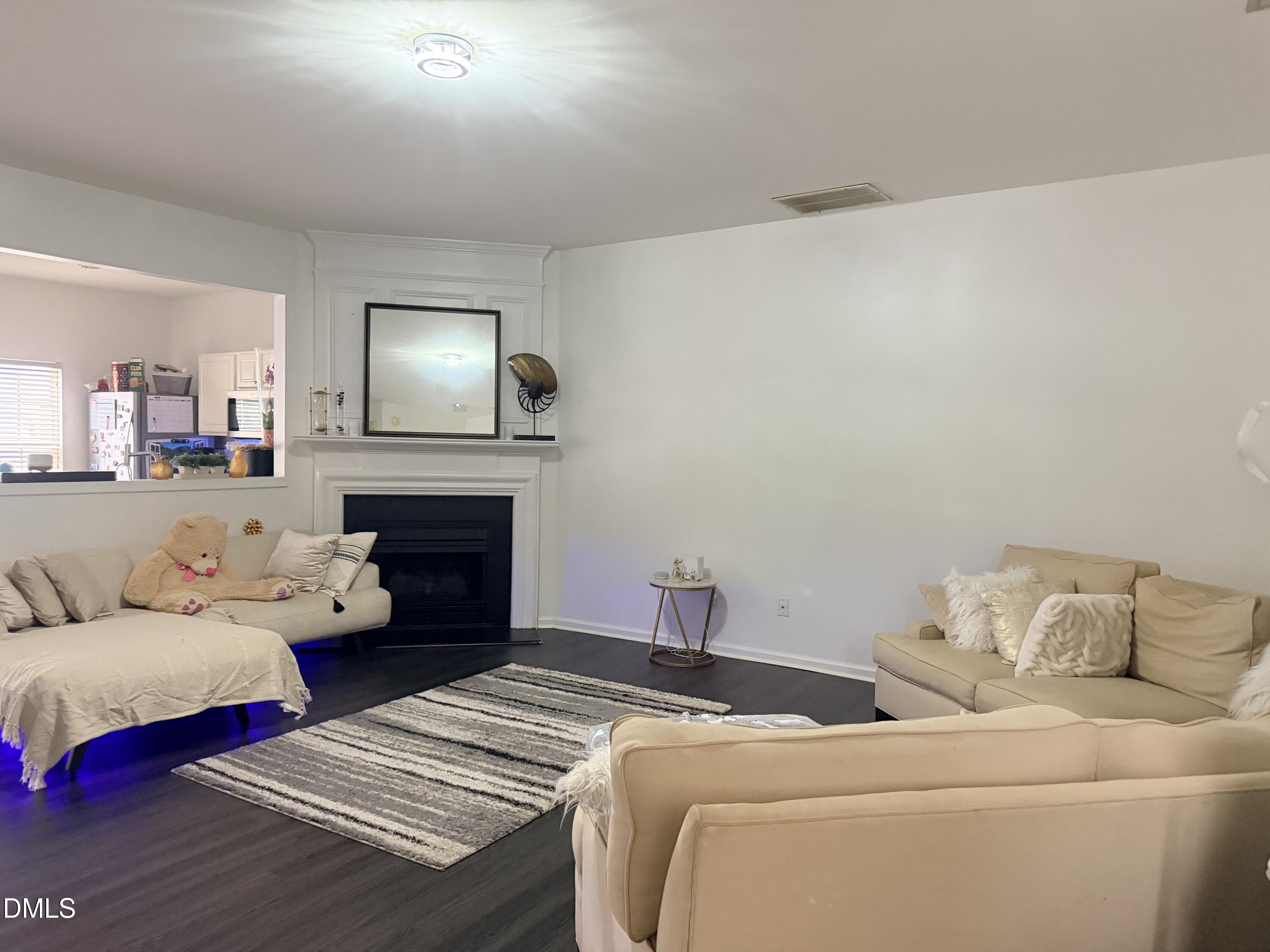 5345 Glen Canyon Road Raleigh, NC 27616 - Photo 2 of 21 a living room with furniture and a fireplace