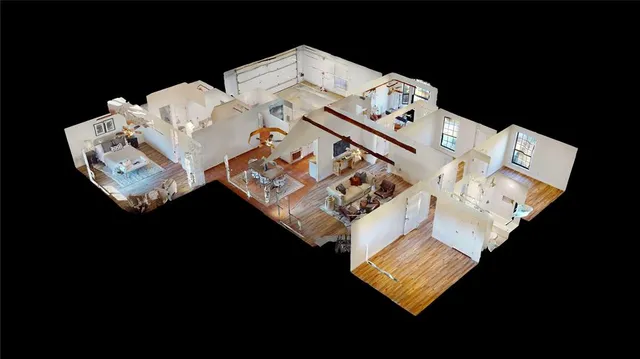 a white bed sitting in a bedroom next to a bed