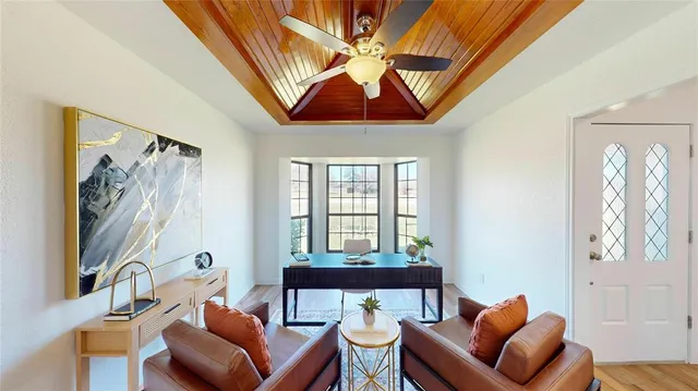 a workspace with furniture and window