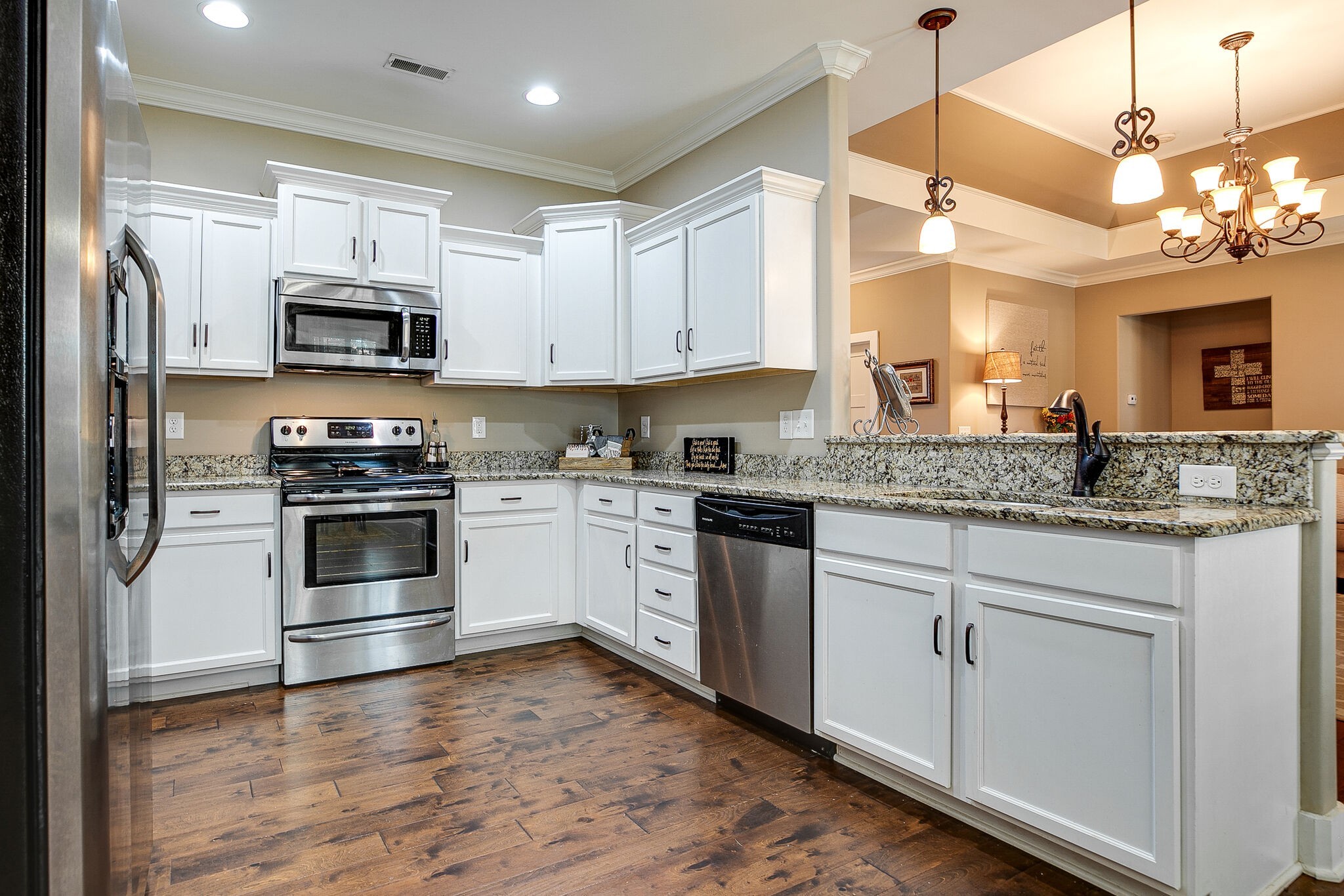 1070 Golf View Way Spring Hill, TN 37174 - Photo 12 of 31 a kitchen with granite countertop a stove a sink and a refrigerator