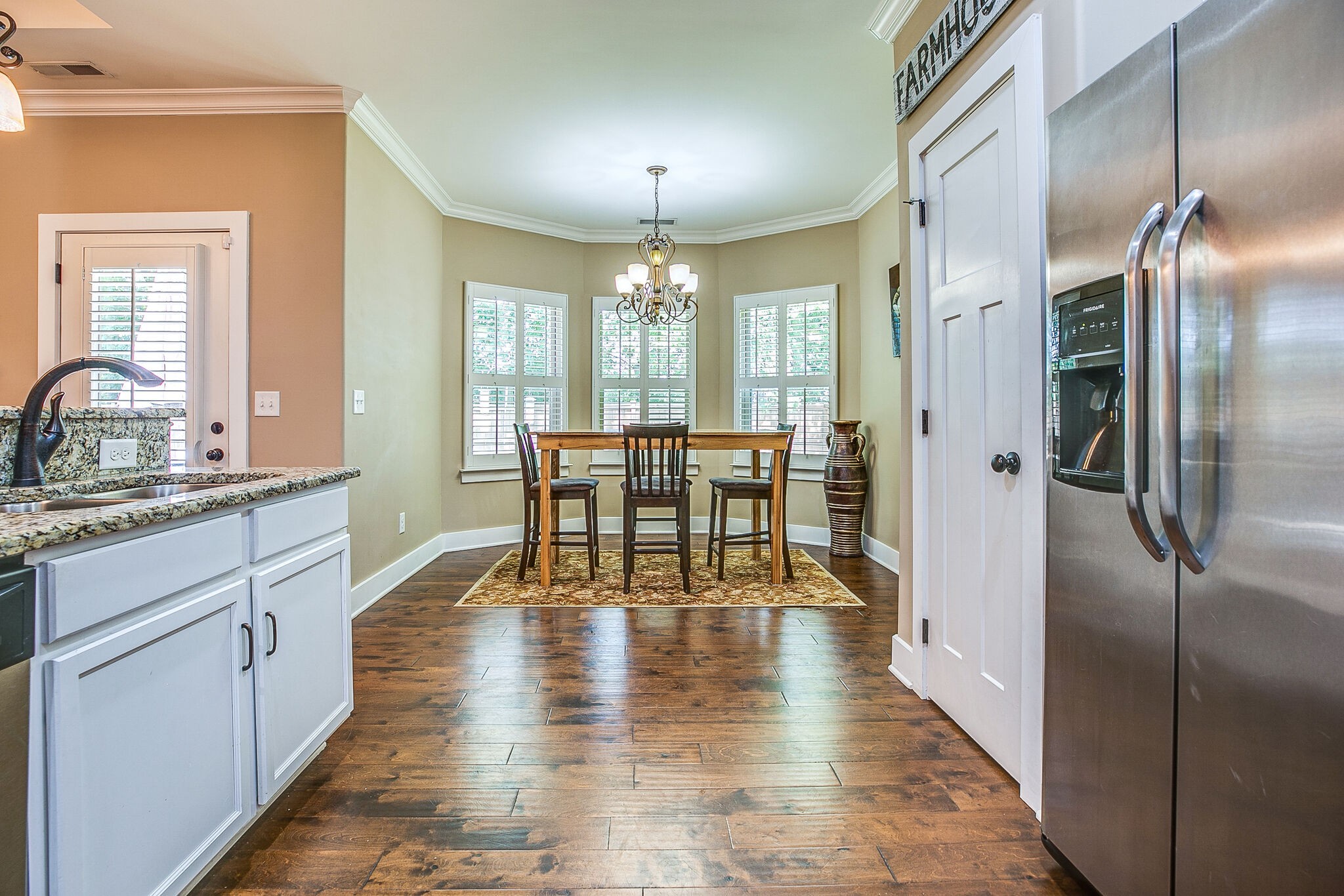 1070 Golf View Way Spring Hill, TN 37174 - Photo 14 of 31 a view of a kitchen with dining table and chairs