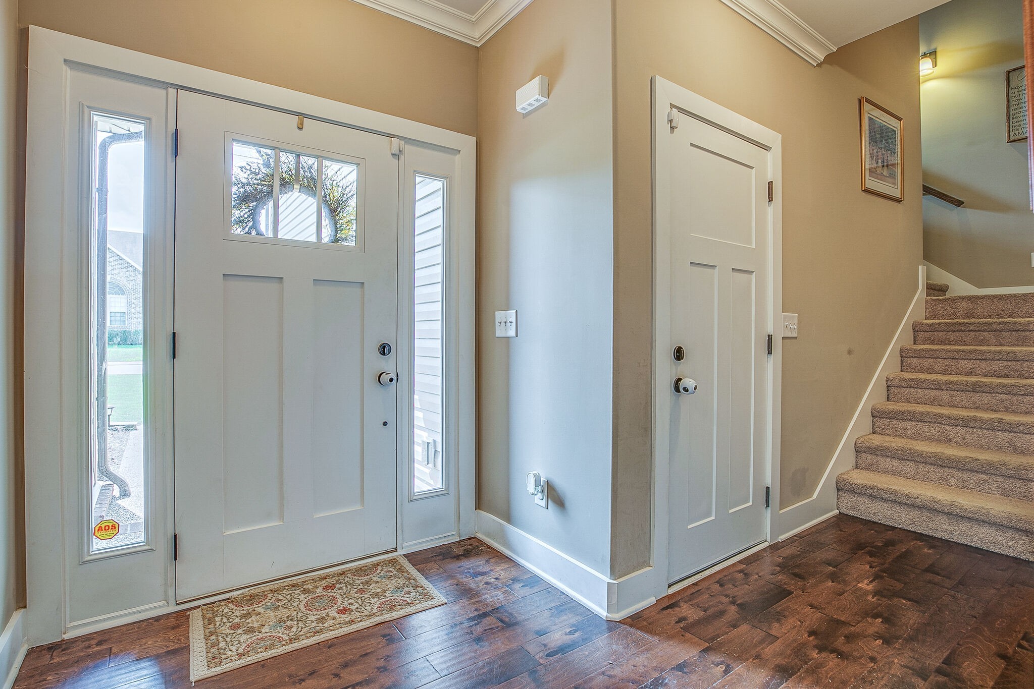 1070 Golf View Way Spring Hill, TN 37174 - Photo 4 of 31 a view of a hallway with wooden floor and entryway