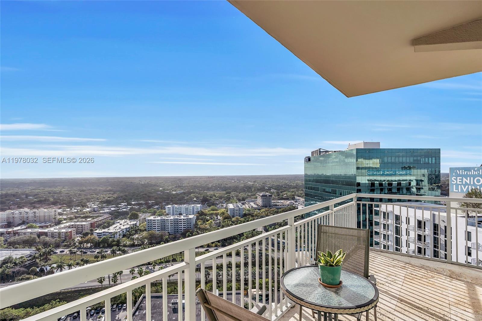 9066 Southwest 73rd Court, Unit PH2402 Miami, FL 33156 - Photo 21 of 45 a balcony with city view and ocean view