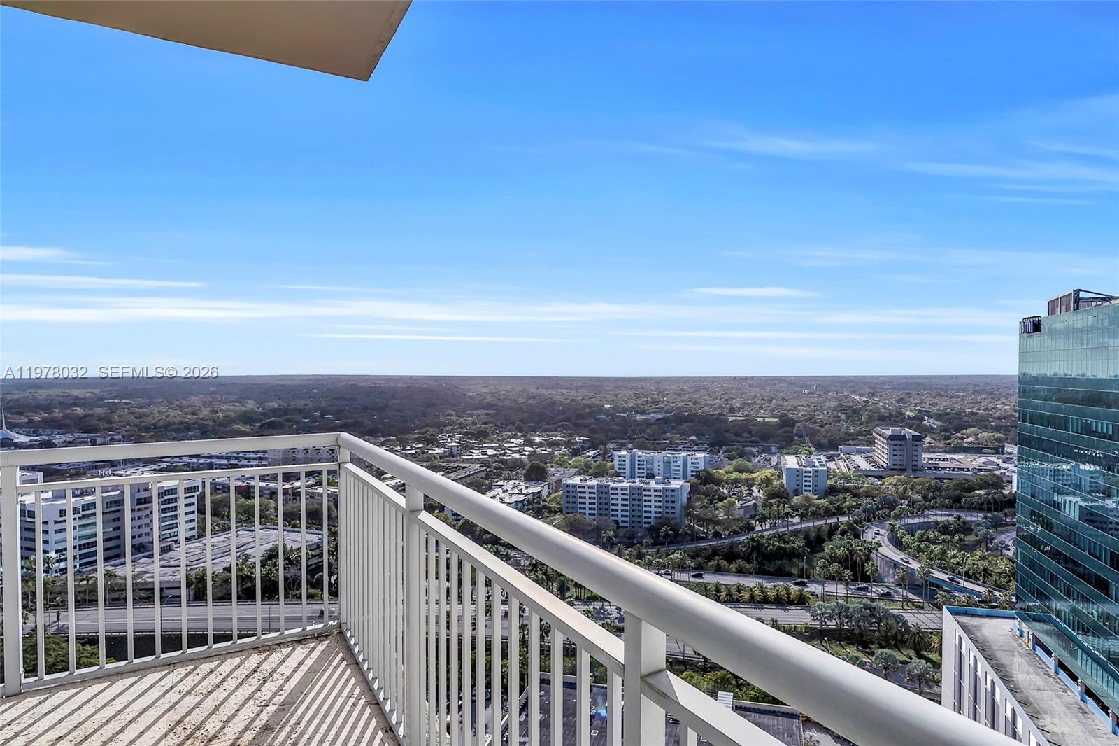 9066 Southwest 73rd Court, Unit PH2402 Miami, FL 33156 - Photo 22 of 45 a view of city from balcony