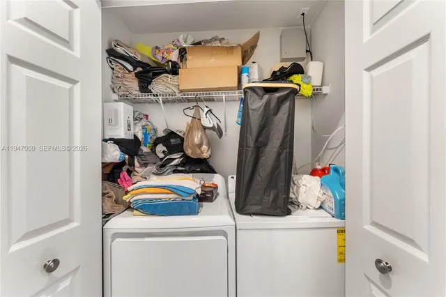 a utility room with dryer and washer