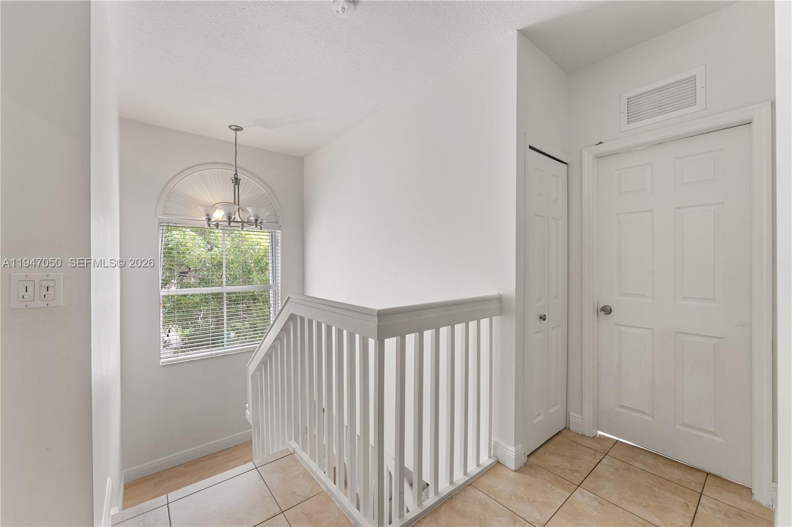 20032 Southwest 128th Court Miami, FL 33177 - Photo 17 of 28 a view of entryway with wooden floor