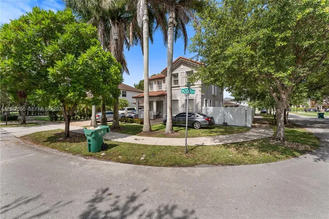 a view of a park with plants and trees