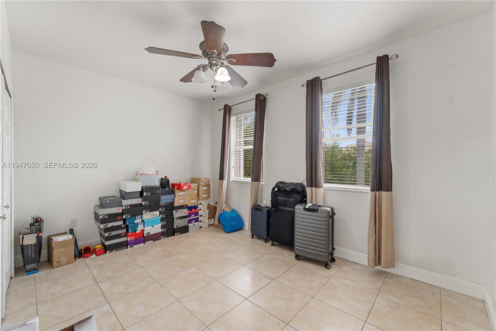 20032 Southwest 128th Court Miami, FL 33177 - Photo 25 of 28 a view of a workspace with furniture and a window