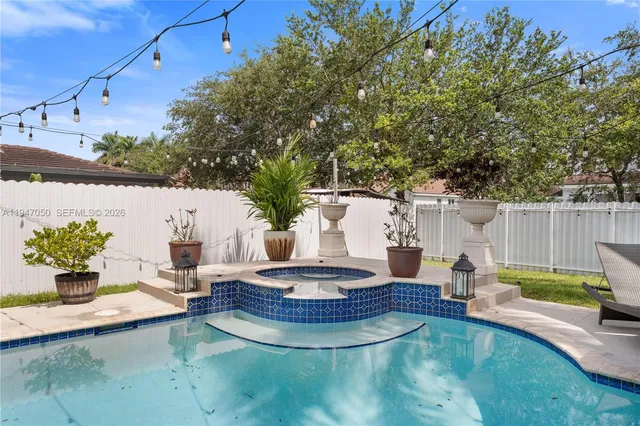 a view of a backyard with sitting area