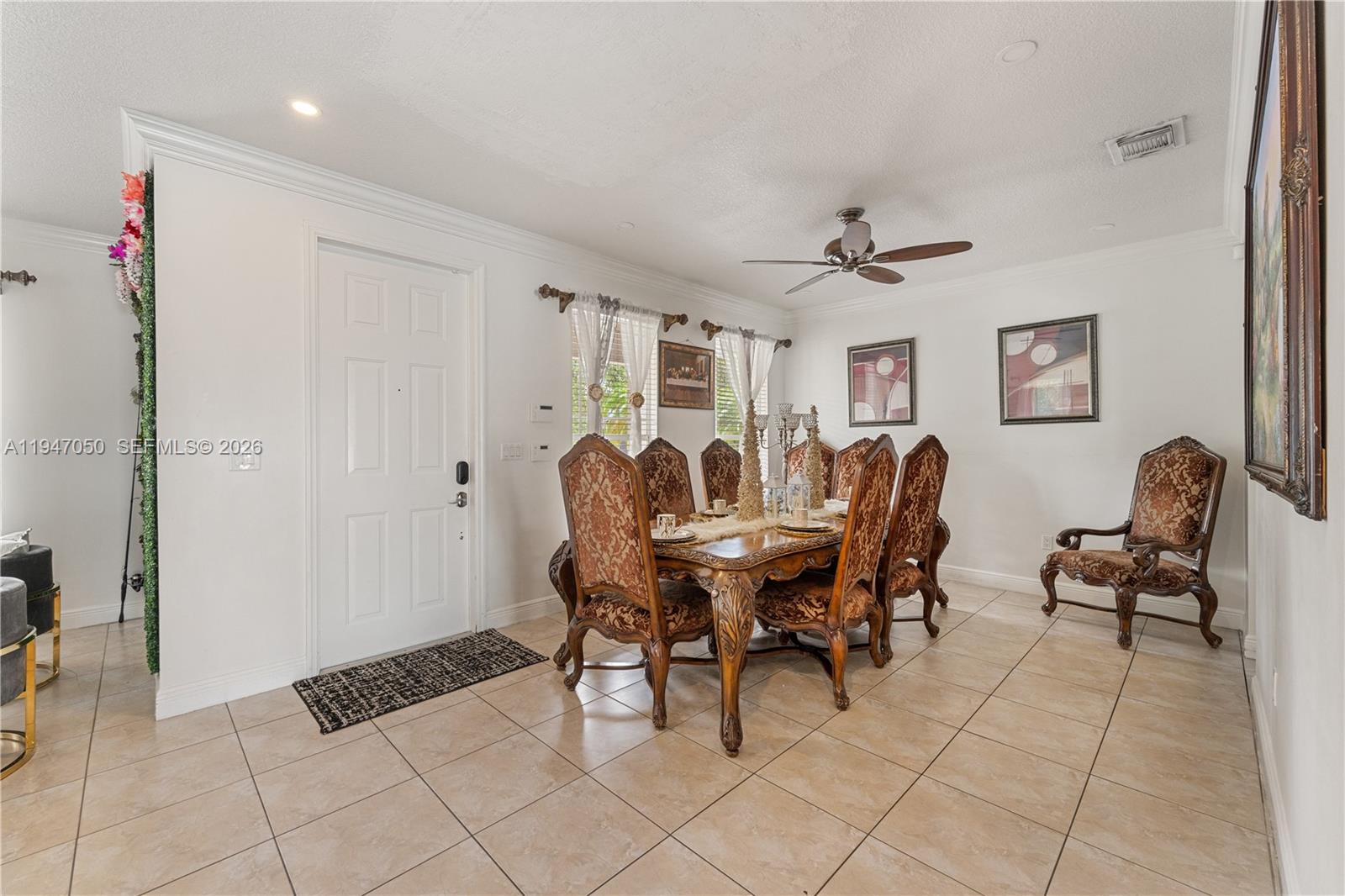 20032 Southwest 128th Court Miami, FL 33177 - Photo 4 of 28 a view of a dining room with furniture