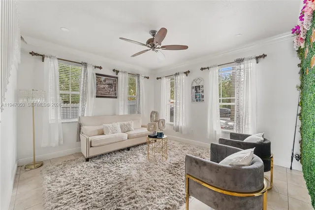a living room with furniture and a large window