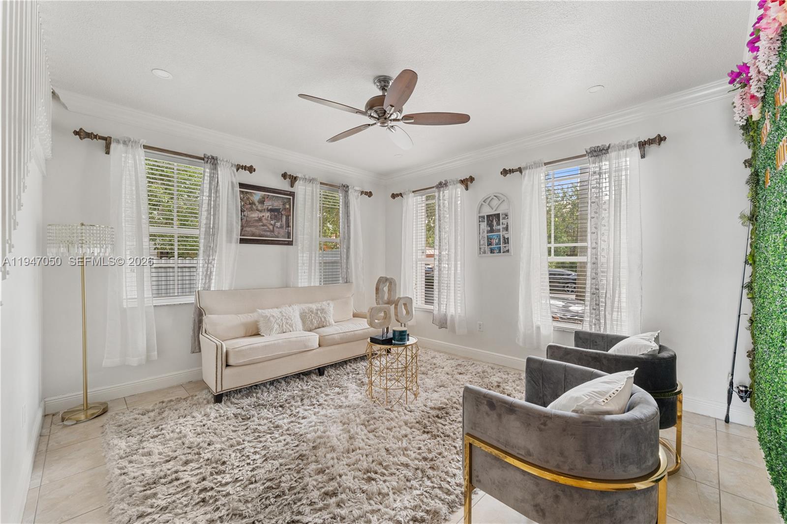 20032 Southwest 128th Court Miami, FL 33177 - Photo 5 of 28 a living room with furniture and a large window
