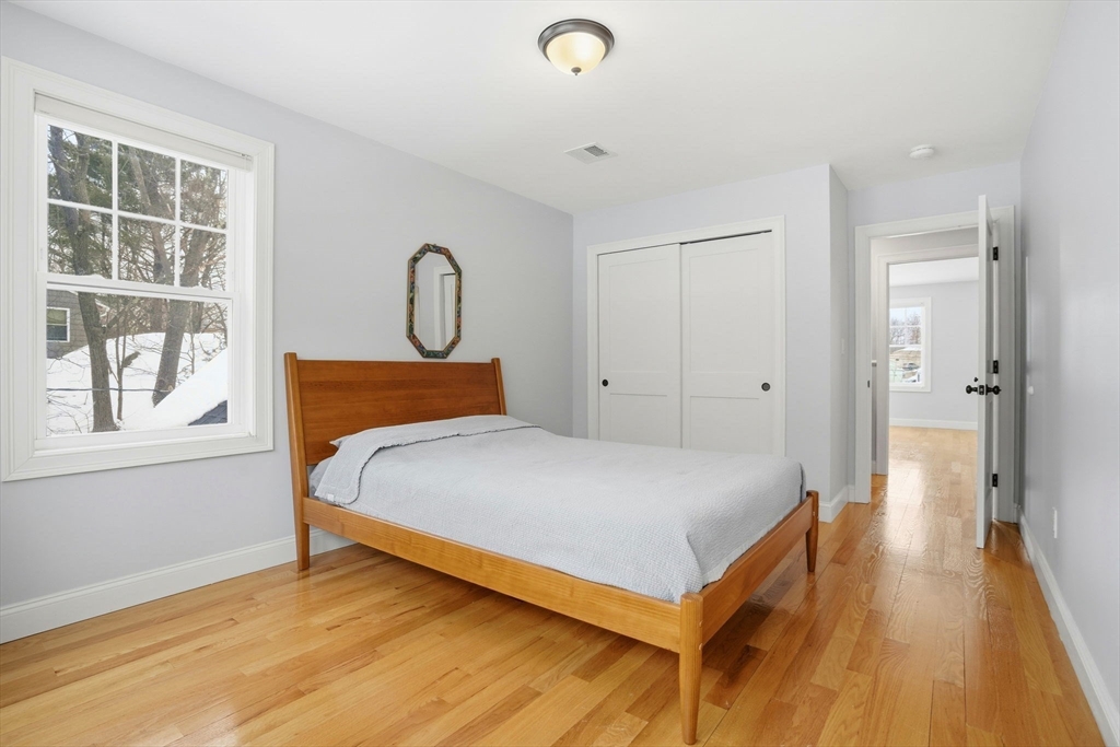 27 Pine Street, Unit 27 Dedham, MA 02026 - Photo 16 of 35 a bedroom with a bed and a window
