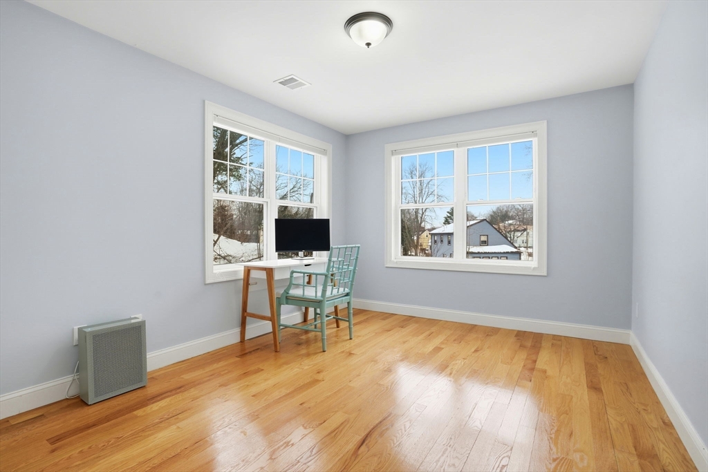 27 Pine Street, Unit 27 Dedham, MA 02026 - Photo 19 of 35 a view of a workspace with furniture and a window