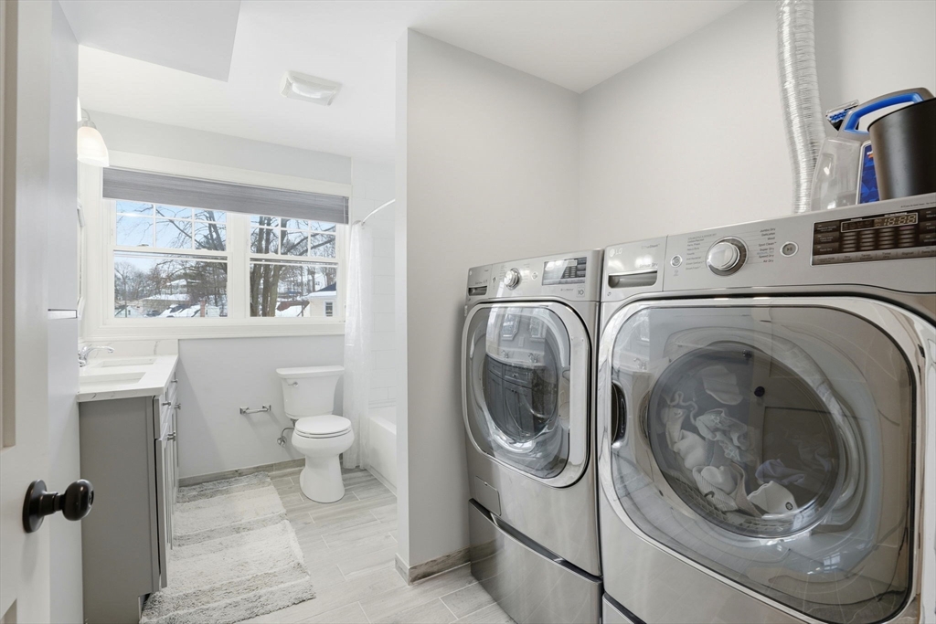 27 Pine Street, Unit 27 Dedham, MA 02026 - Photo 24 of 35 a utility room with sink dryer and washer
